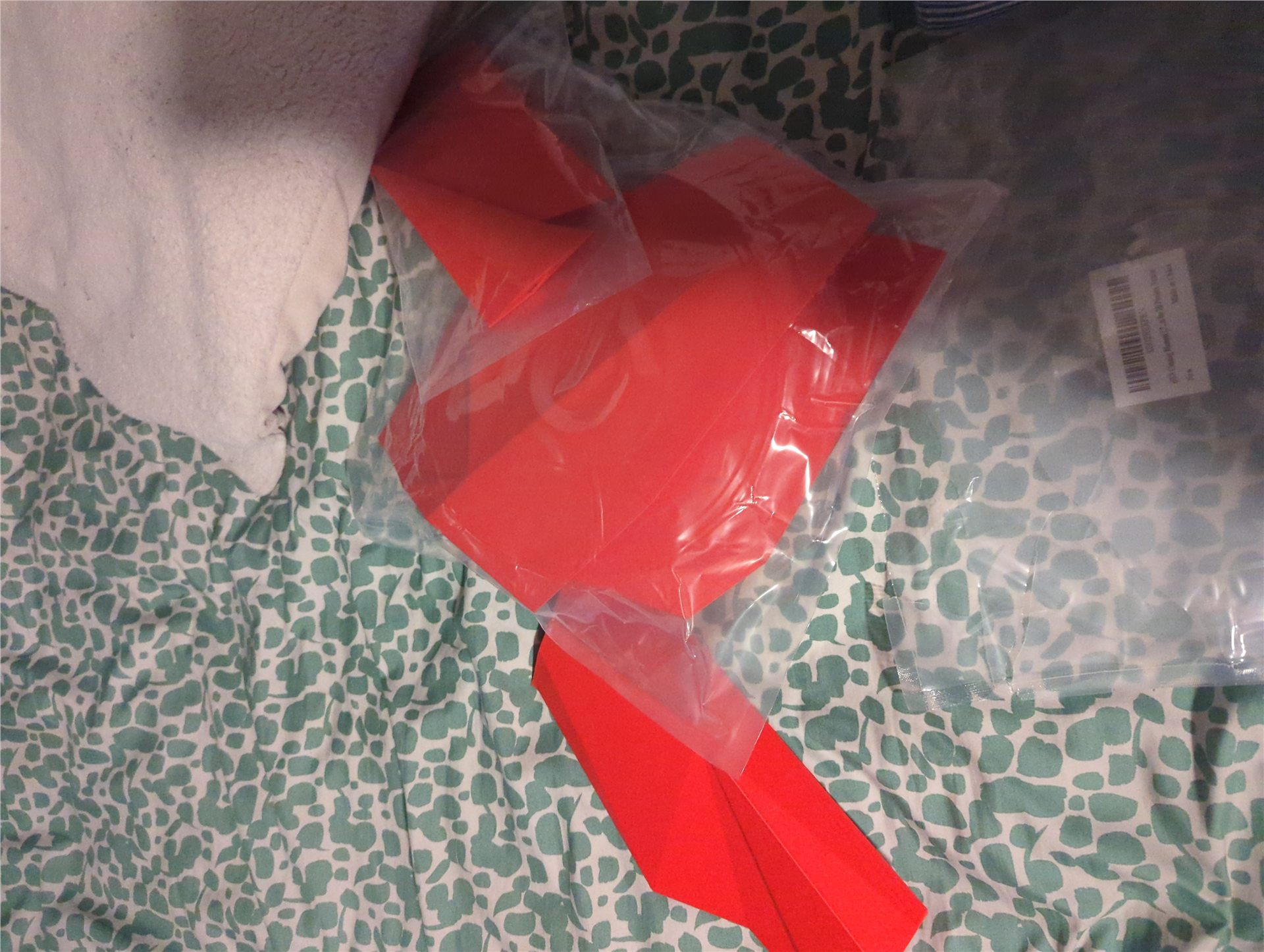 Red blade pieces for an Old School RuneScape dragon scimitar cosplay prop packaged before assembly