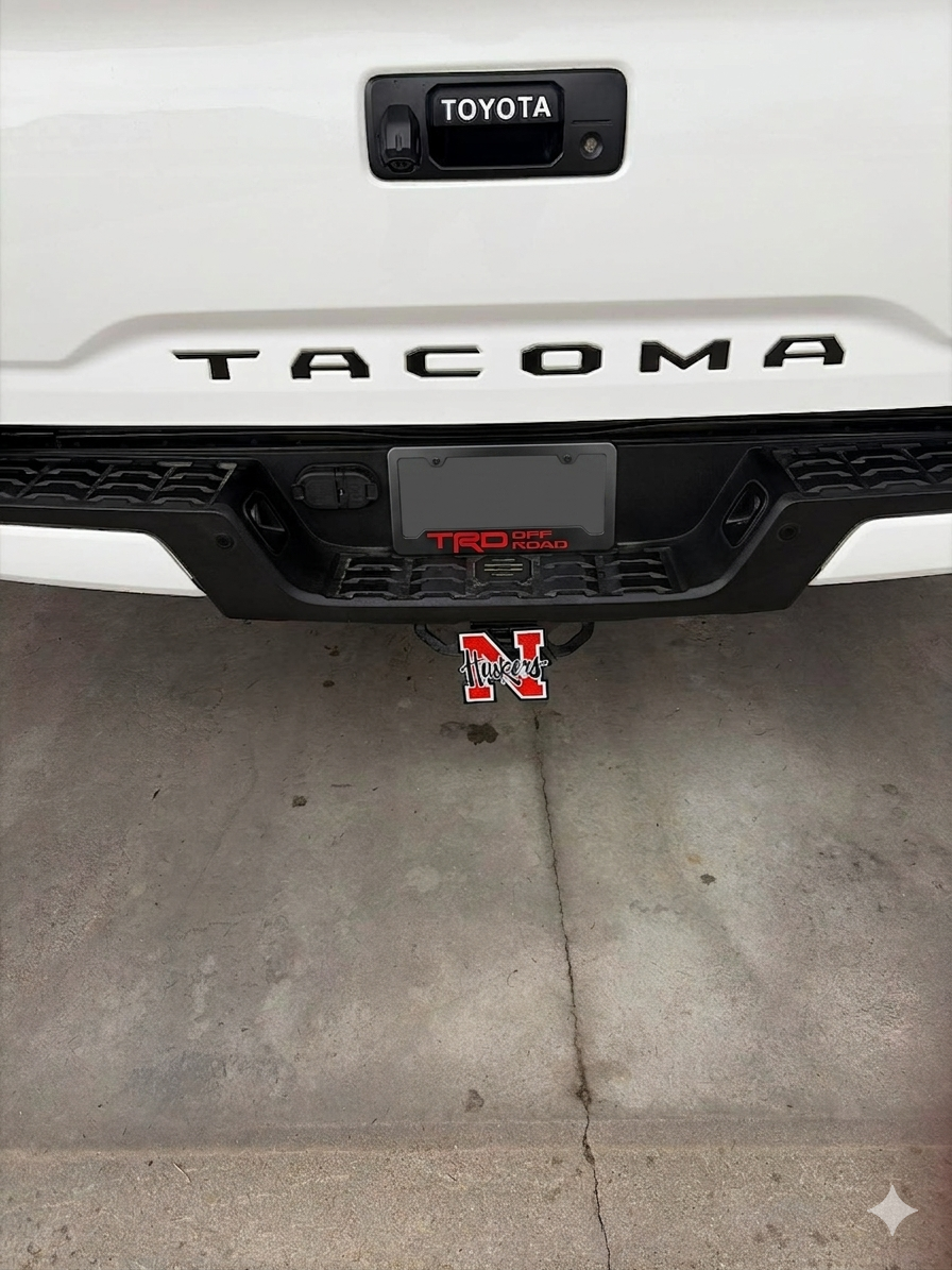 Custom Tacoma tailgate lettering and hitch accent